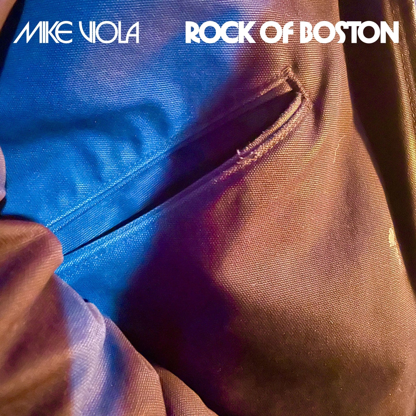 Album cover featuring Mike Viola Rock of Boston text over a blue fabric pocket.
