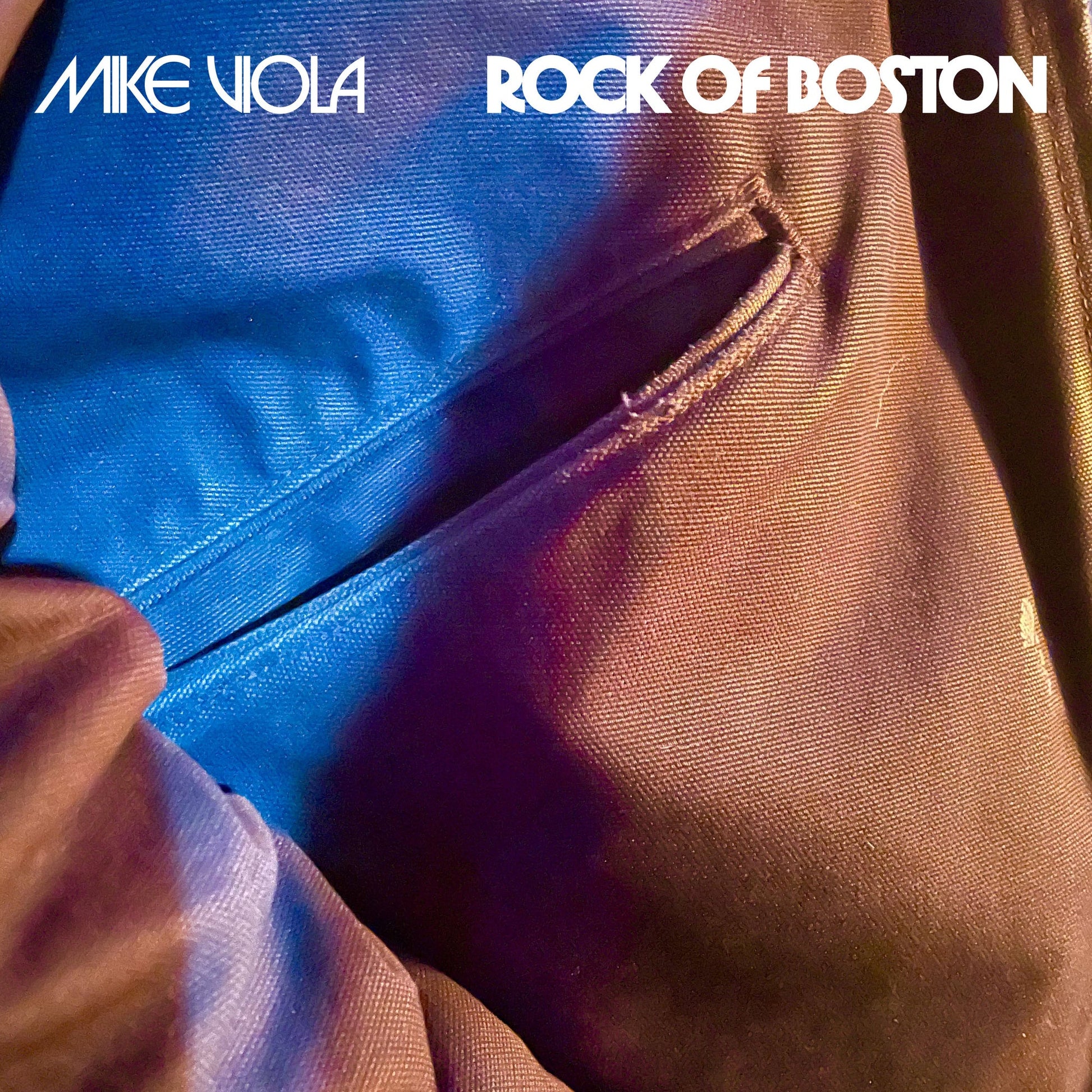 Album cover featuring Mike Viola Rock of Boston text over a blue fabric pocket.