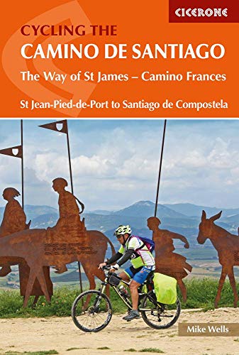 Book cover: cyclist riding past metal sculptures on the Camino de Santiago.