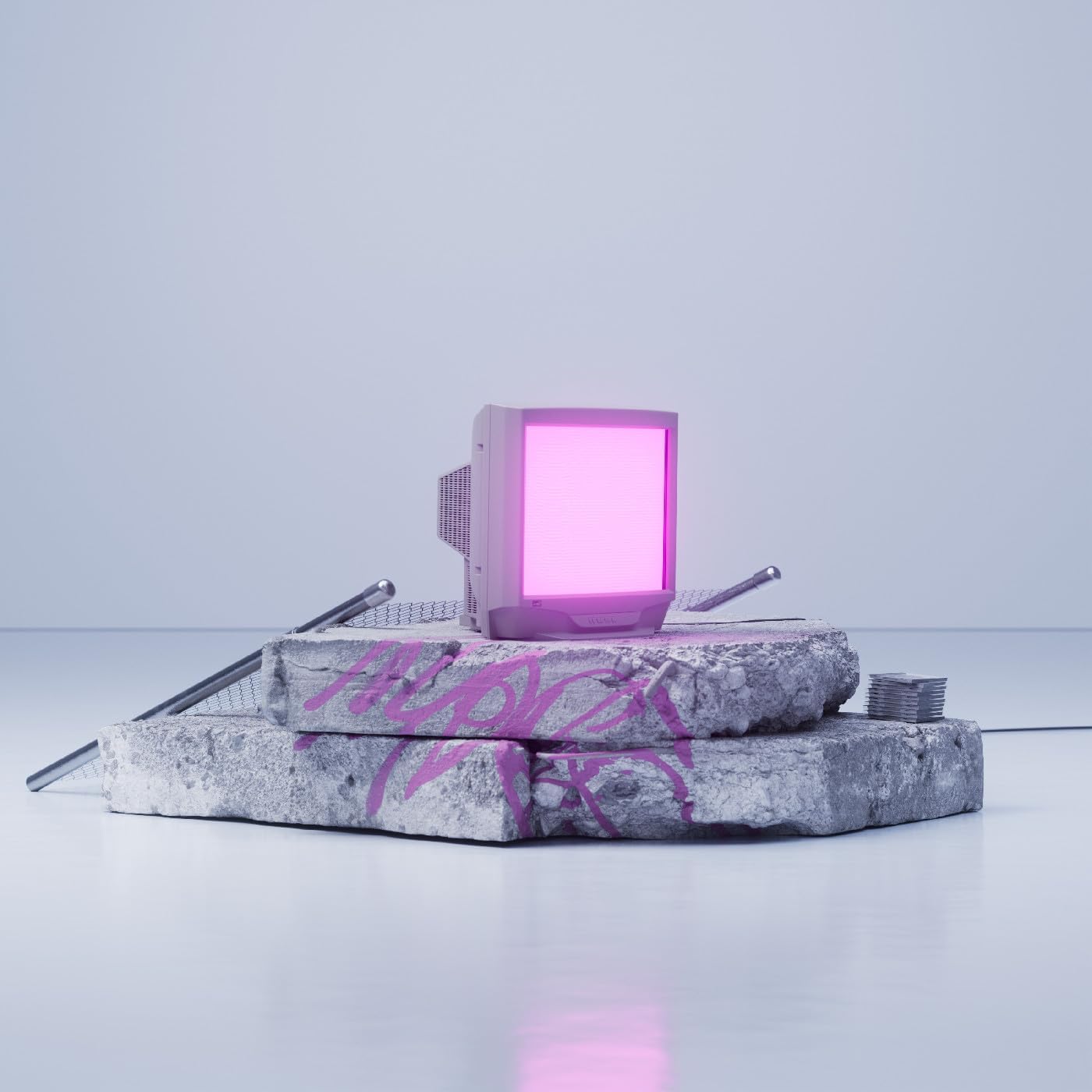A glowing pink computer monitor sits on stacked concrete blocks with pink graffiti.