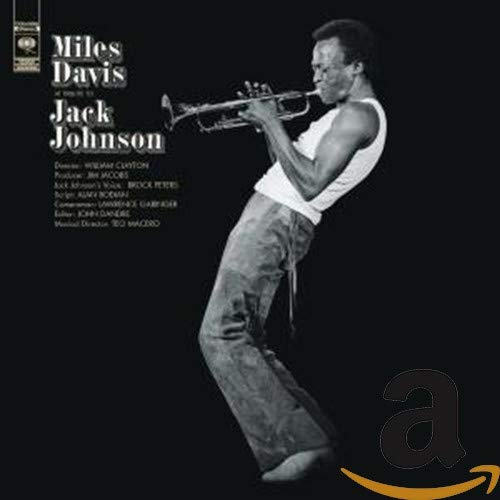 CD cover: Miles Davis playing trumpet, black and white portrait.