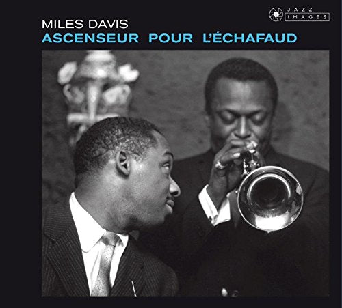 "Album cover with black-and-white photo of two men, one playing trumpet."