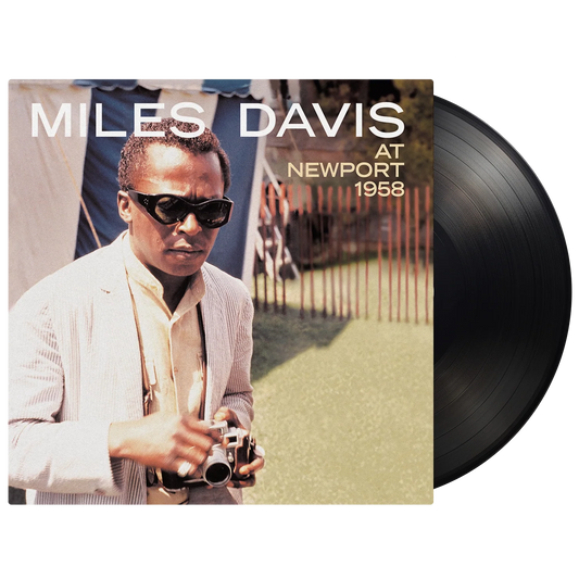 Miles Davis album cover “At Newport 1958” with a vinyl record.
