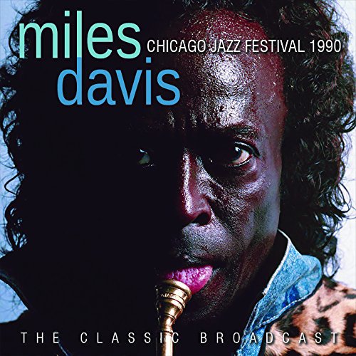 CD cover featuring a close-up portrait of Miles Davis with his trumpet.