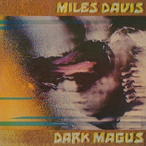 "Vinyl record album cover with Miles Davis' face and 'Dark Magus' title."
