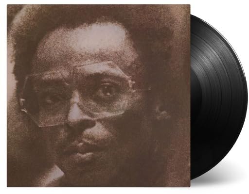 Miles Davis vinyl record with a portrait of the musician.