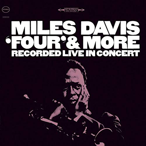 Album cover with Miles Davis holding a trumpet, black background, white text.