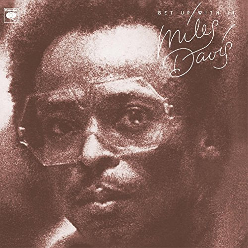 Sepia-toned album cover featuring a close-up portrait of Miles Davis.