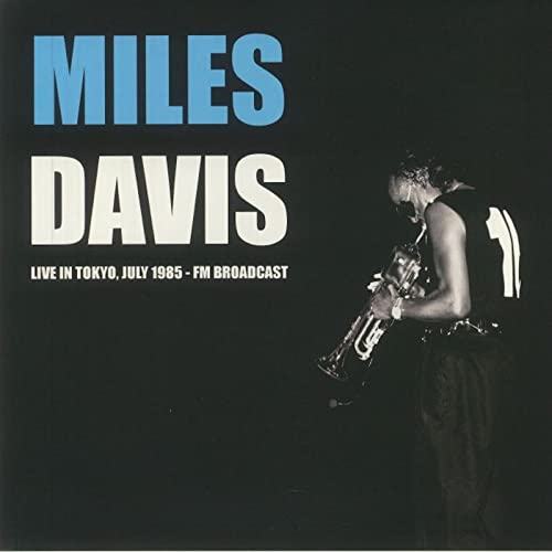 Miles Davis album cover featuring a black and white photo of him playing trumpet.