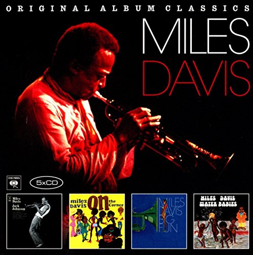 Miles Davis playing trumpet with four smaller album covers displayed below on black background.