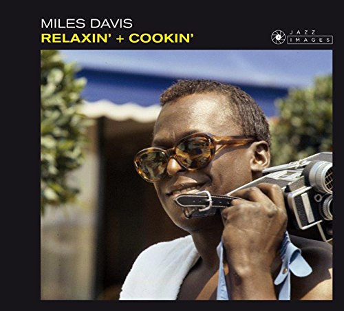 Miles Davis album cover featuring him with sunglasses and a camera.