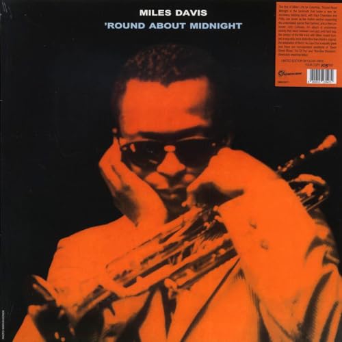 Miles Davis album cover, “Round About Midnight,” featuring a portrait and trumpet.