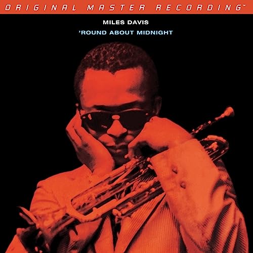 Miles Davis portrait with trumpet, album cover for “Round About Midnight.”