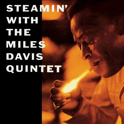 Album cover showing Miles Davis lighting a cigarette in warm, orange-toned lighting.