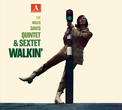 Album cover of "Walkin'" by Miles Davis, featuring a man on a traffic light.