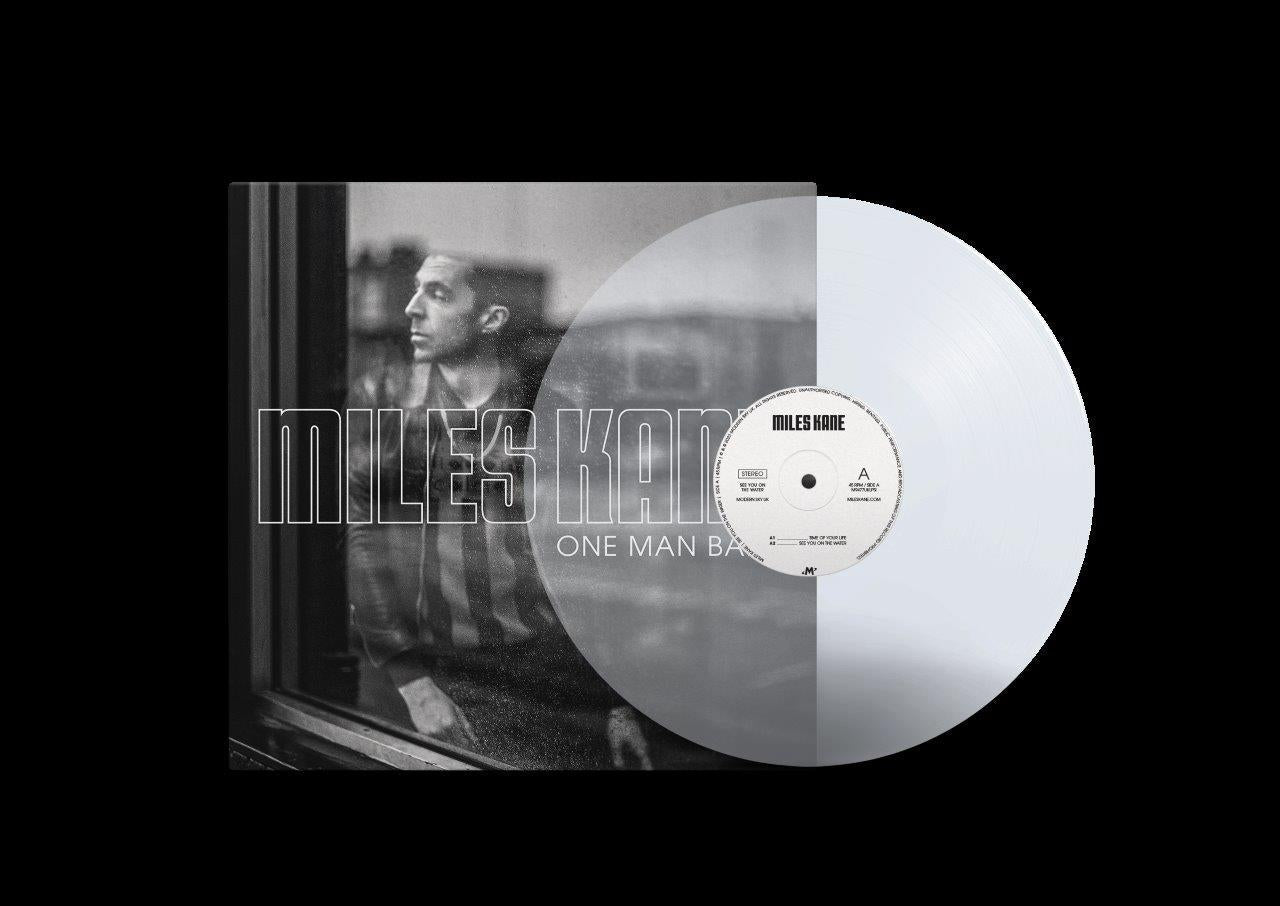 White vinyl record and cover art with black and white photo of man.