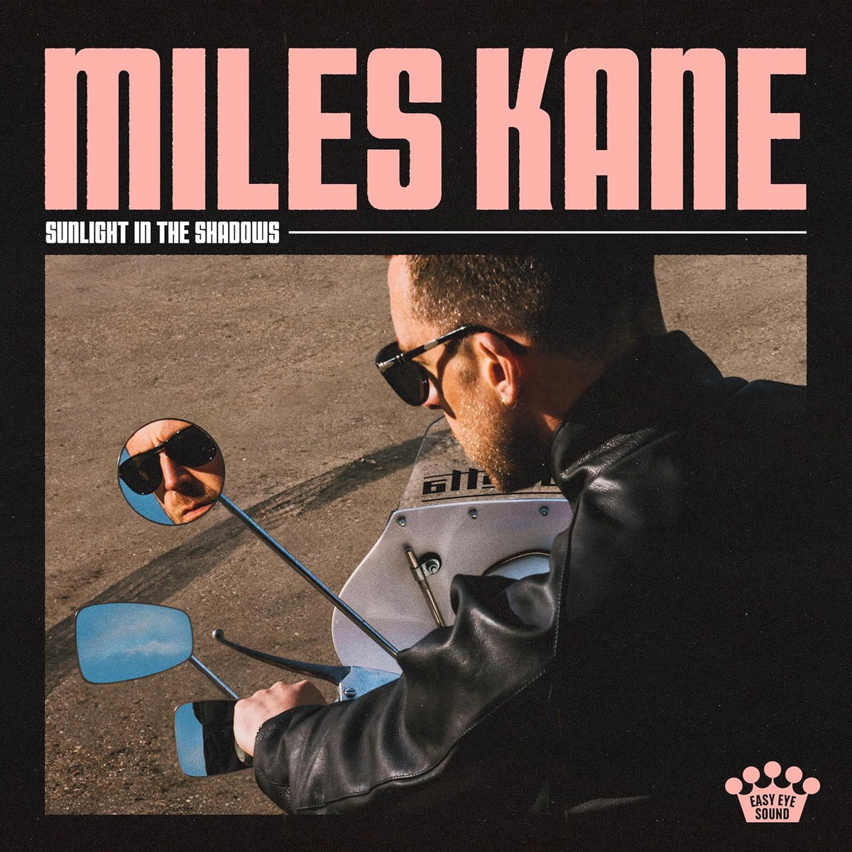 Miles Kane album cover featuring a man on a motorcycle, reflected in mirrors.