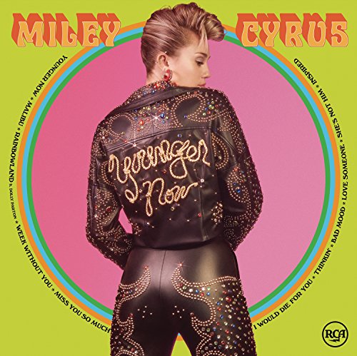 Miley Cyrus album cover, “Younger Now,” featuring her in a denim jacket.