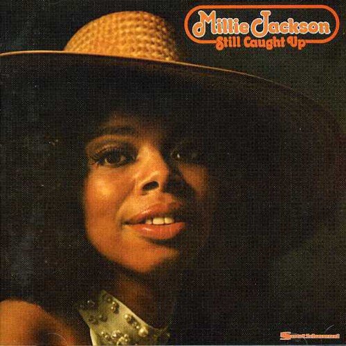 Millie Jackson's album cover featuring a close-up of her face wearing a straw hat.