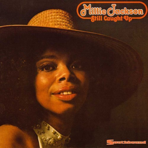 Millie Jackson wearing a wide-brimmed hat on the Still Caught Up album cover.