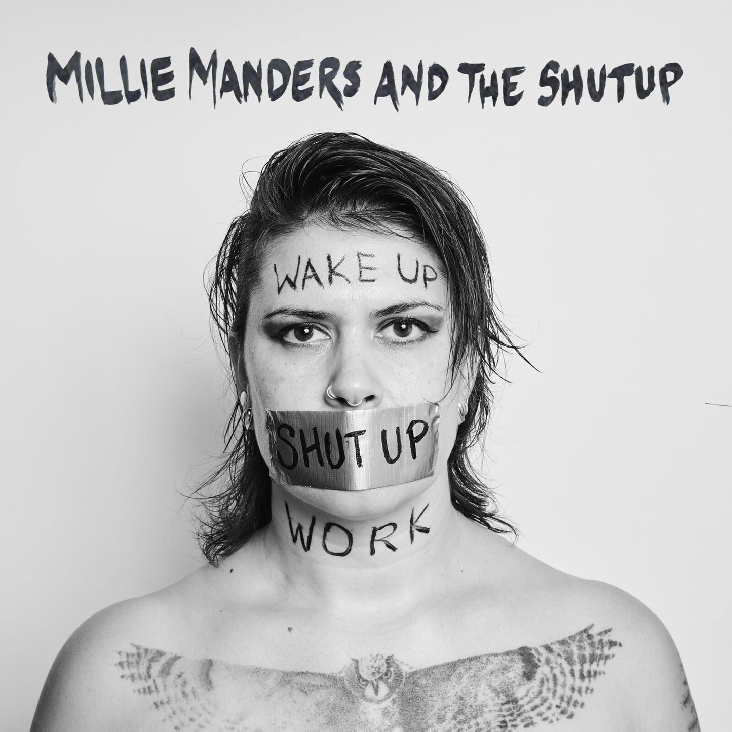 Black and white portrait of a woman with text and tape over her mouth.