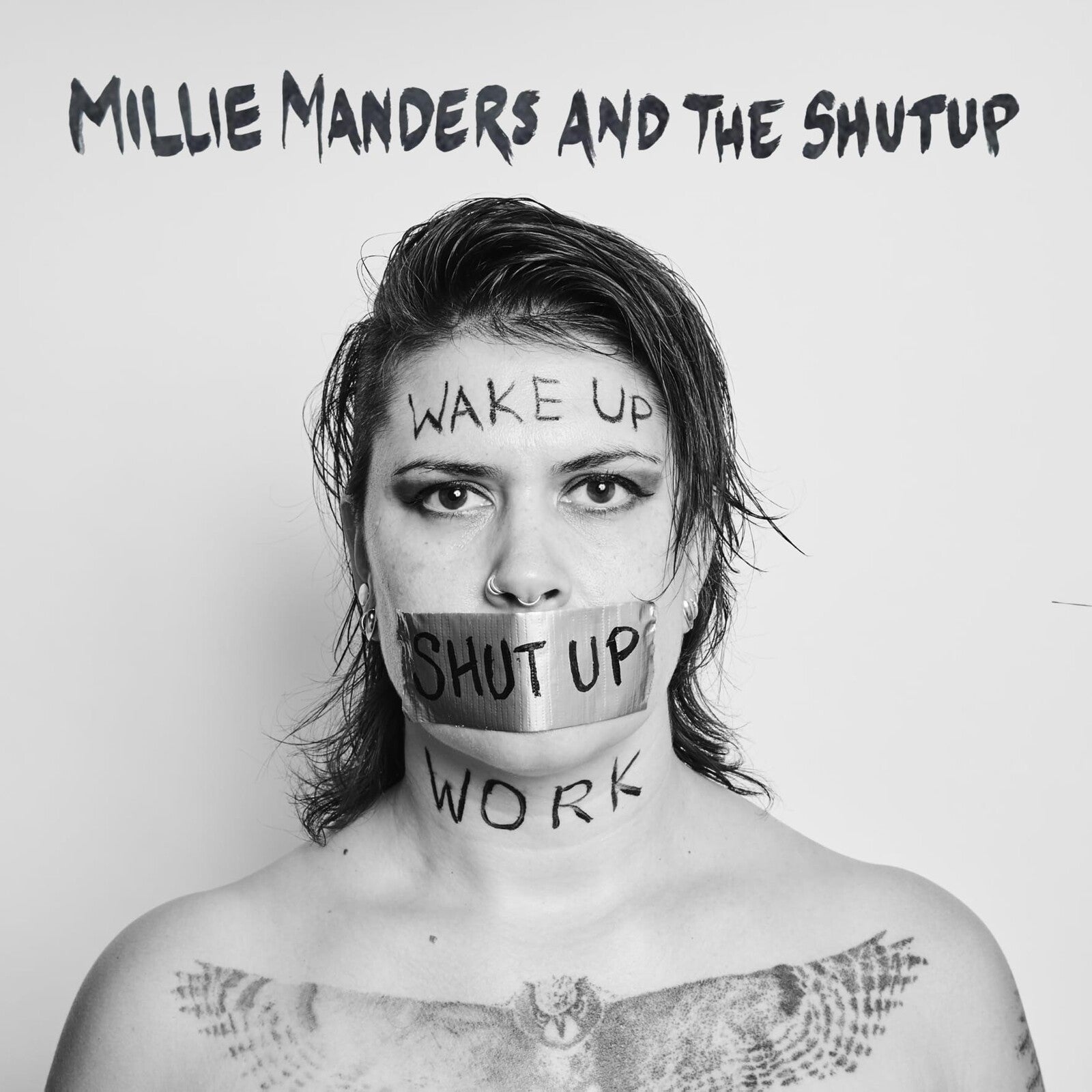 Black and white portrait of a woman with text and tape over her mouth.