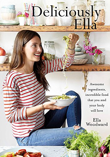 Cookbook cover featuring a woman with food, shelves of ingredients.