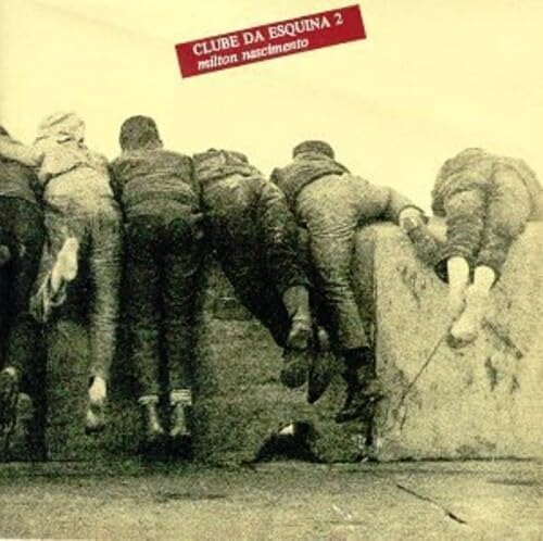 Five people lean over a wall with the album title text at the top.