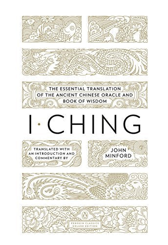 Book cover for I Ching with gold-line illustrations of dragons, fish, and floral patterns.