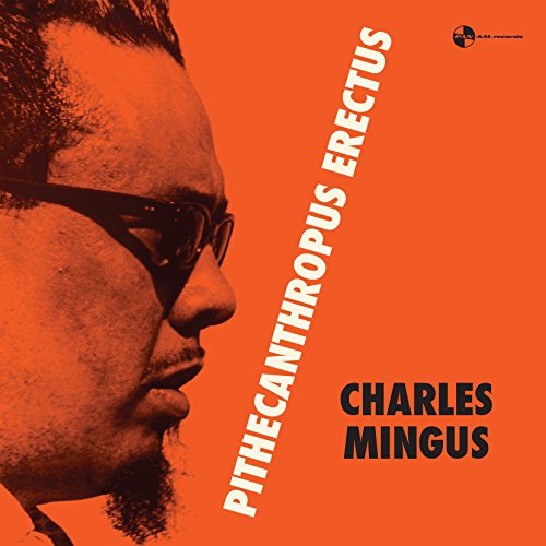 Charles Mingus album cover: orange background, profile portrait, bold white text.