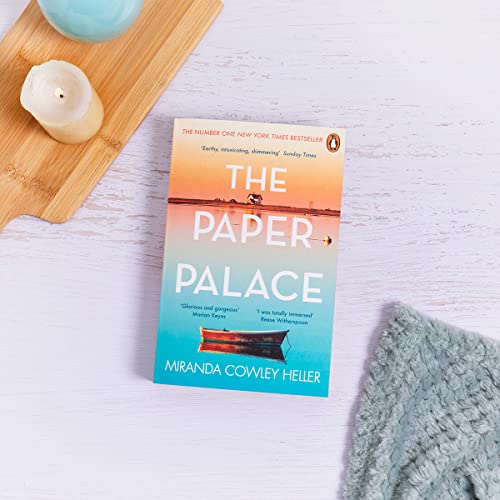 The Paper Palace book cover featuring a boat on water, with candle and blanket.