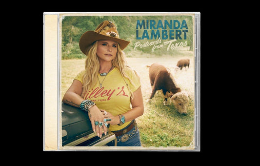 Miranda Lambert wearing a cowboy hat and yellow shirt, standing outdoors with cattle nearby.