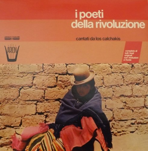 Vinyl record cover: a person in traditional clothing sits against a stone wall.