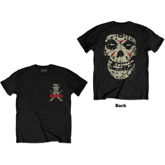 A man wearing a black t-shirt with a Misfits skull and machete chest logo.