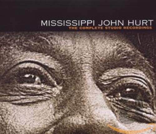 Close-up of Mississippi John Hurt’s face on a CD album cover.