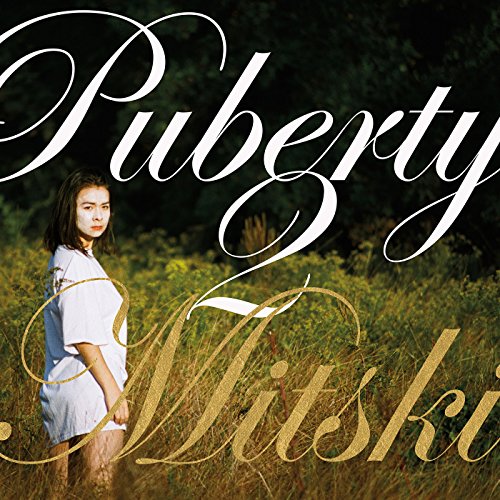 Album cover for Mitski’s “Puberty 2” featuring a woman in a field.