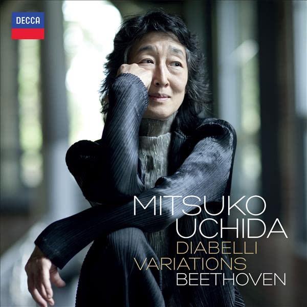 CD cover featuring pianist Mitsuko Uchida in a dark, textured garment.