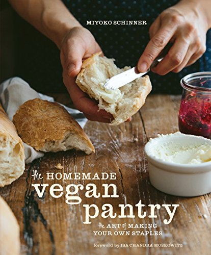 Cookbook cover: hands spreading vegan butter on bread with jam nearby.