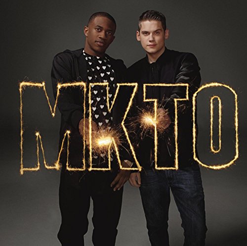 Two men stand behind the word MKTO written in glowing sparkler light.