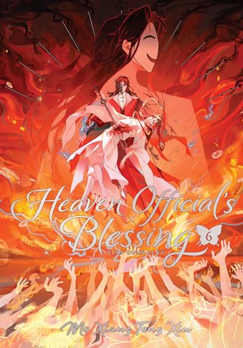 Book cover showing two anime-style characters in red and white robes amidst flames.