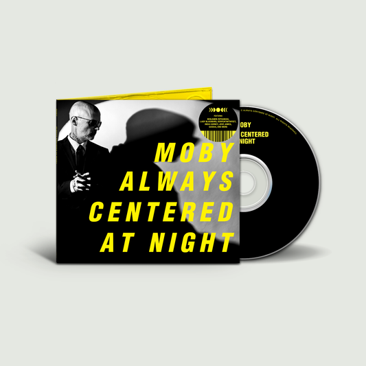 Moby album "Always Centered At Night" CD with yellow cover and disc.
