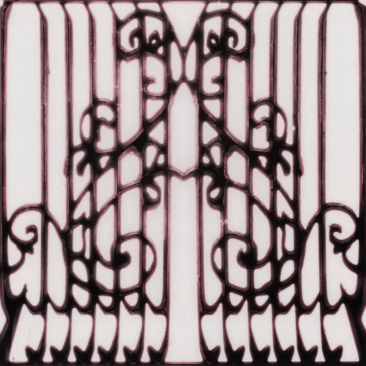 Symmetrical black ornate iron gate pattern on a white background.