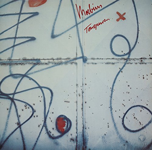 The image depicts a white wall with blue and red graffiti. Alt text: White wall with blue and red graffiti and writing.