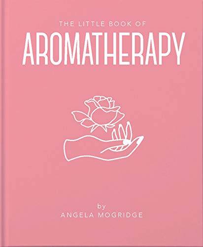 Pink book cover with white text reading "Aromatherapy" and a hand holding flowers.