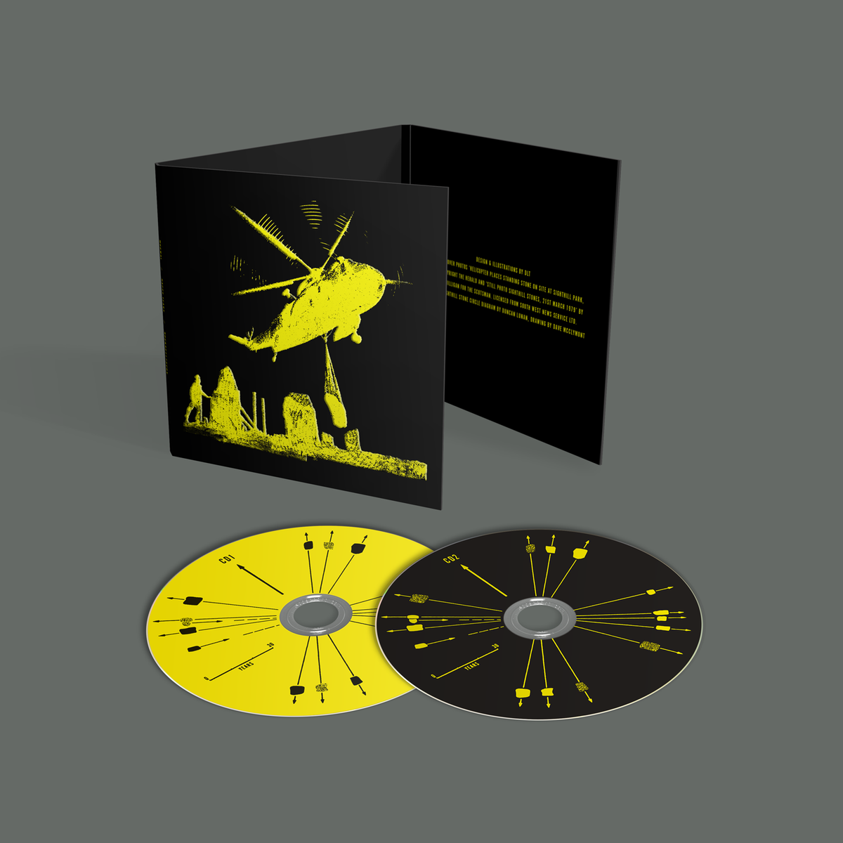 Mogwai "Happy Tears" CD: black packaging, two yellow discs, helicopter graphic.