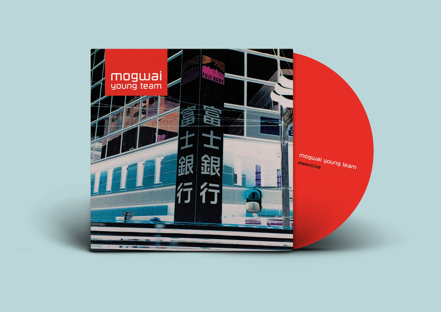Mogwai “Young Team” CD cover with a city building and red disc.
