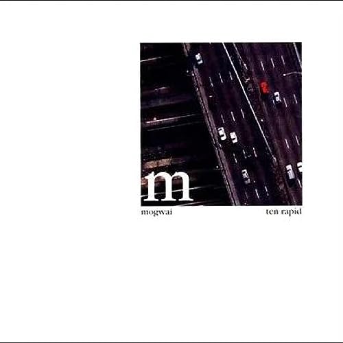 Album cover showing an aerial view of a highway with the text Mogwai Ten Rapid.