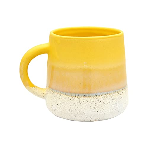Yellow ceramic mug with a speckled base and glazed finish.