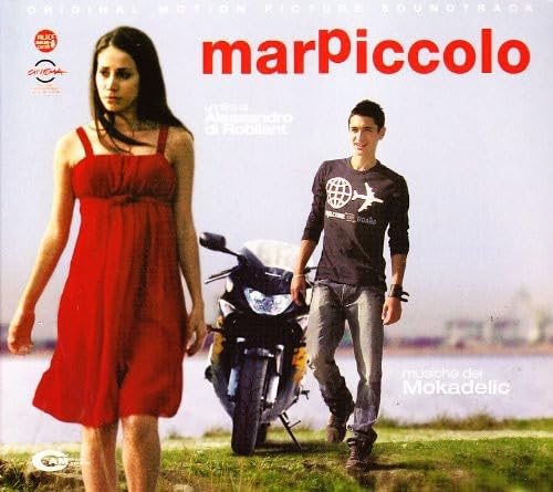 CD cover featuring a couple and a motorcycle by the sea.