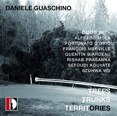 Black and white photograph of a road and trees with text overlay.
